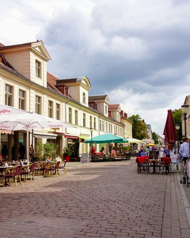 Charming pedestrian street with outdoor cafes and historic buildings