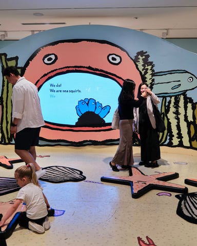 Families exploring interactive exhibits at a science attraction